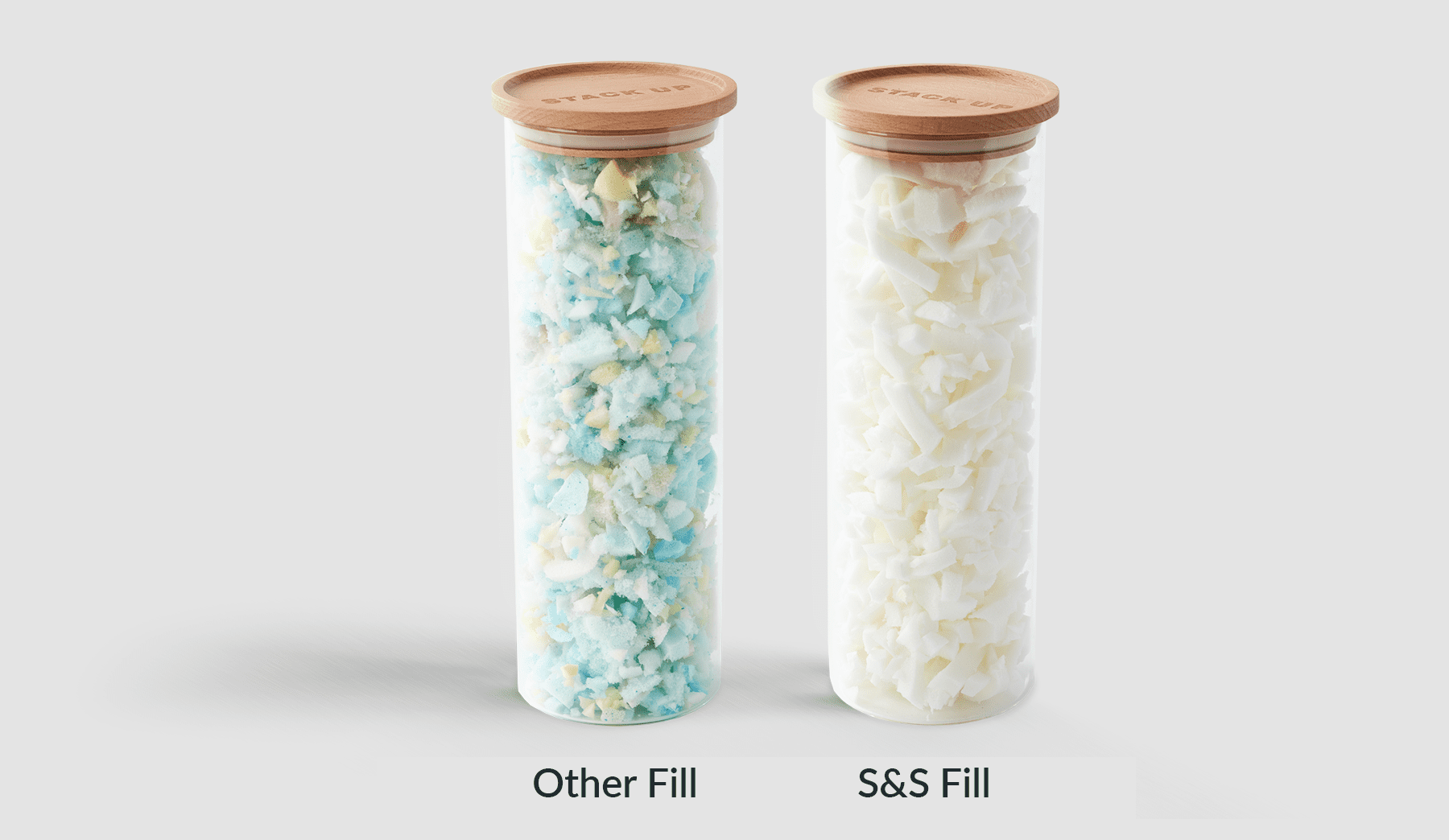 Two containers of shredded memory foam - one contains shreds that are multicoloured while the other is white. 